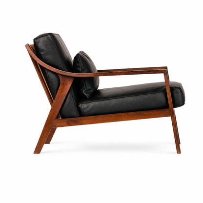 Marlow black upholstered lounge chair, side view showing the frame profile
