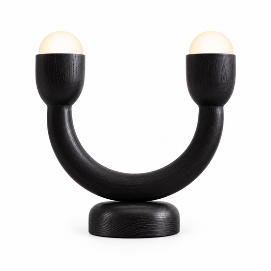 Onda table lamp with two opal glass globes held in a blackened timber U-shaped body