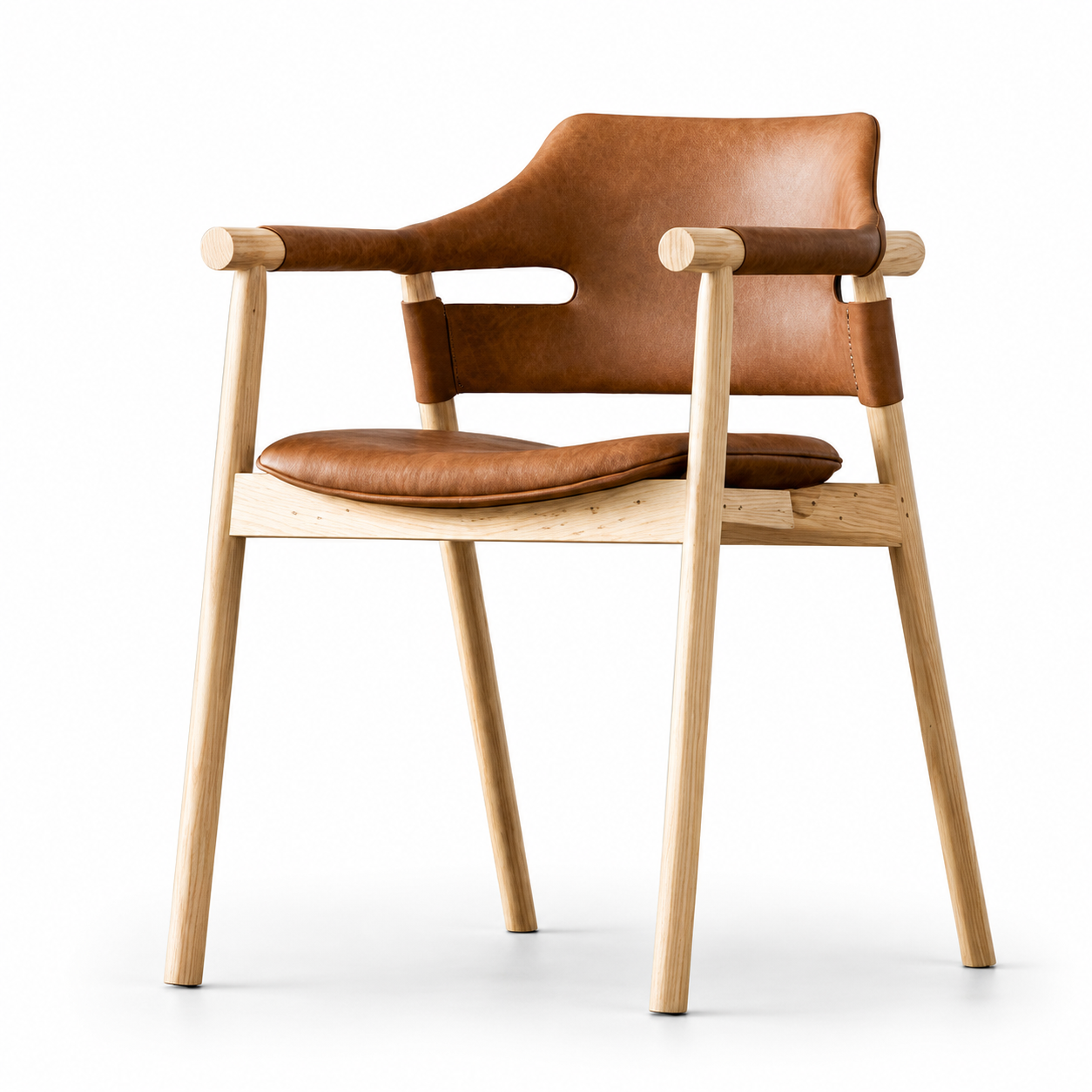 Suri sling armchair with a cognac upholstered back and seat on a pale wood-look frame, three-quarter view