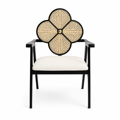 Black square-frame armchair with an open woven clover medallion above the seat back