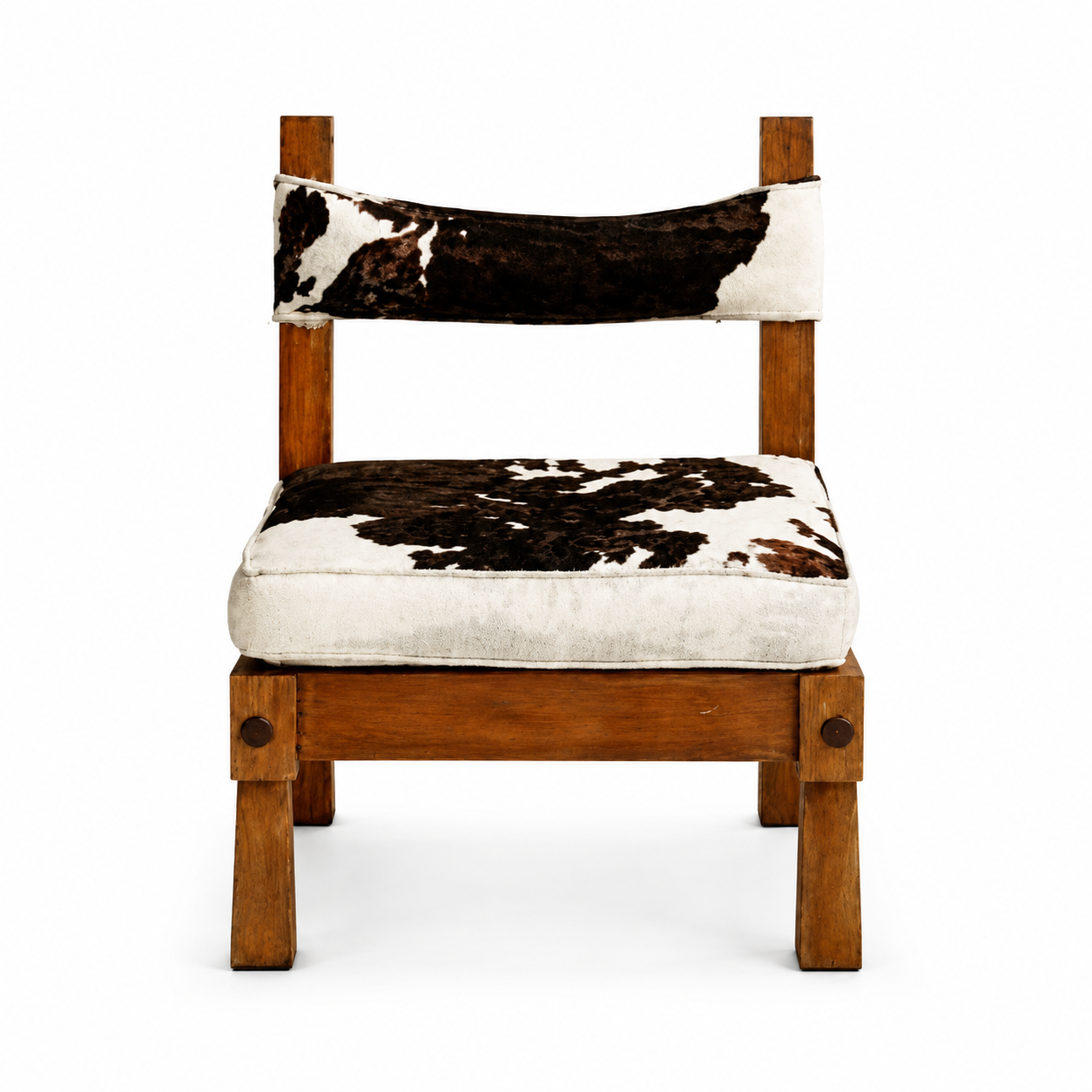 Pampa armless slipper chair upholstered in natural cowhide with a curved back